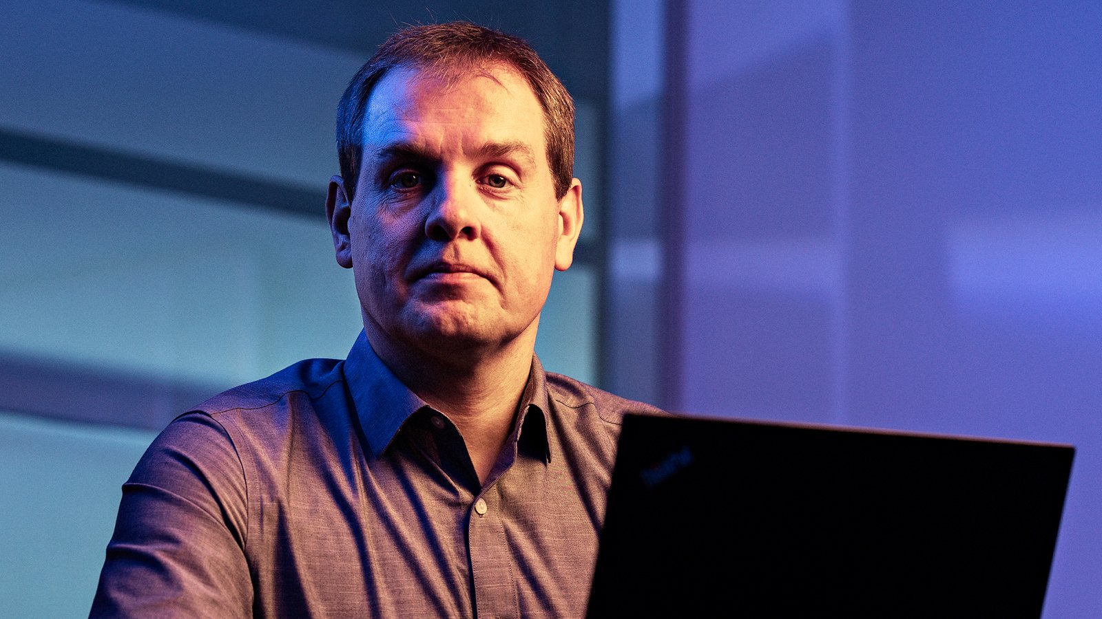 Henrik Lei sitting at a desk in front of a computer